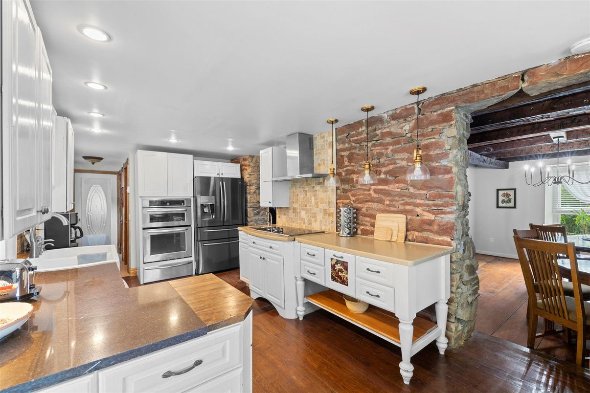 Interior, Kitchen, Pendant Lights, Recessed Lighting, Stainless Steel Appliances, Stone Walls, Wood Texture Flooring