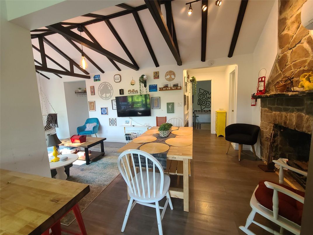 Dining room, Fireplace, Interior, Living room, Pendant Lights, Wooden Beams, Wood Texture Flooring