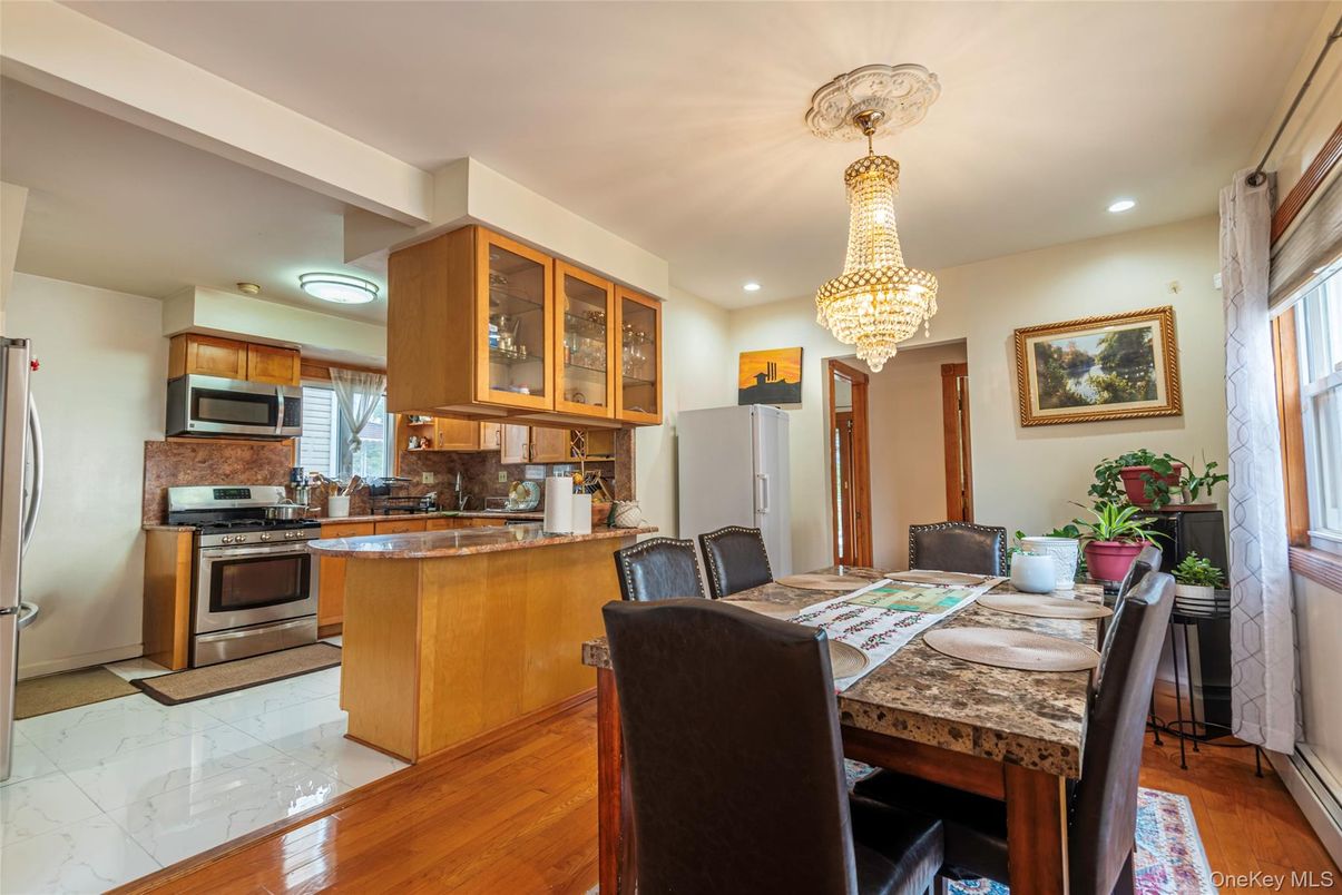 Chandelier, Dining room, Interior, Kitchen, Marble, Recessed Lighting, Stainless Steel Appliances, Wood Texture Flooring