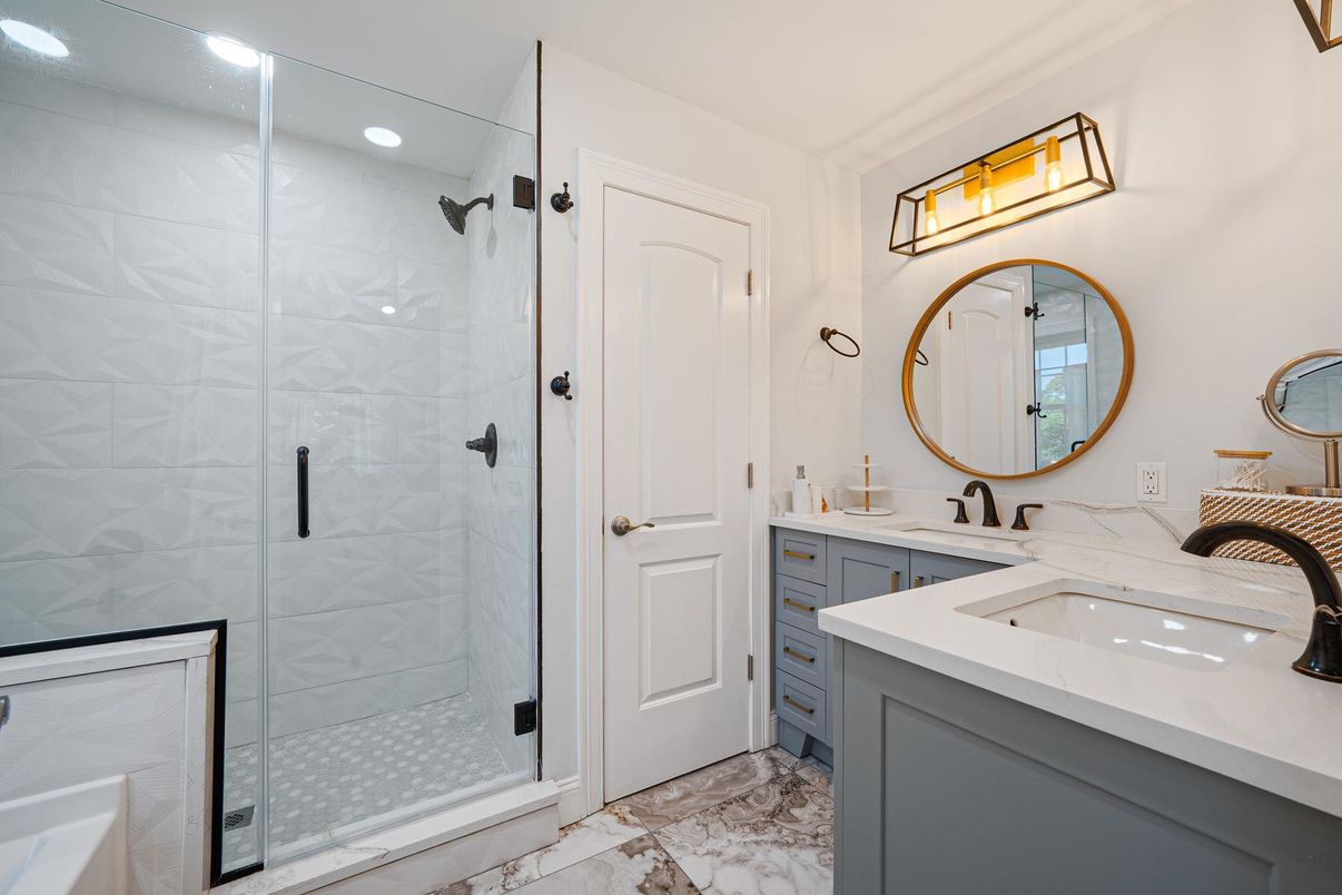 Bathroom, Dual Sink Vanities, Glass Shower, Interior, Marble, Marble Walls, Recessed Lighting