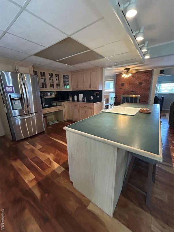 Fireplace, Interior, Kitchen, Stainless Steel Appliances, Stone Walls, Wood Texture Flooring