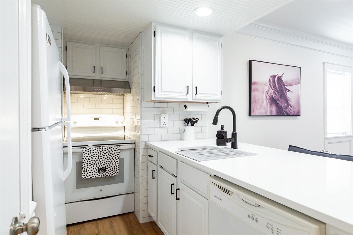 Interior, Kitchen, Recessed Lighting, Tile Countertops, Wood Texture Flooring