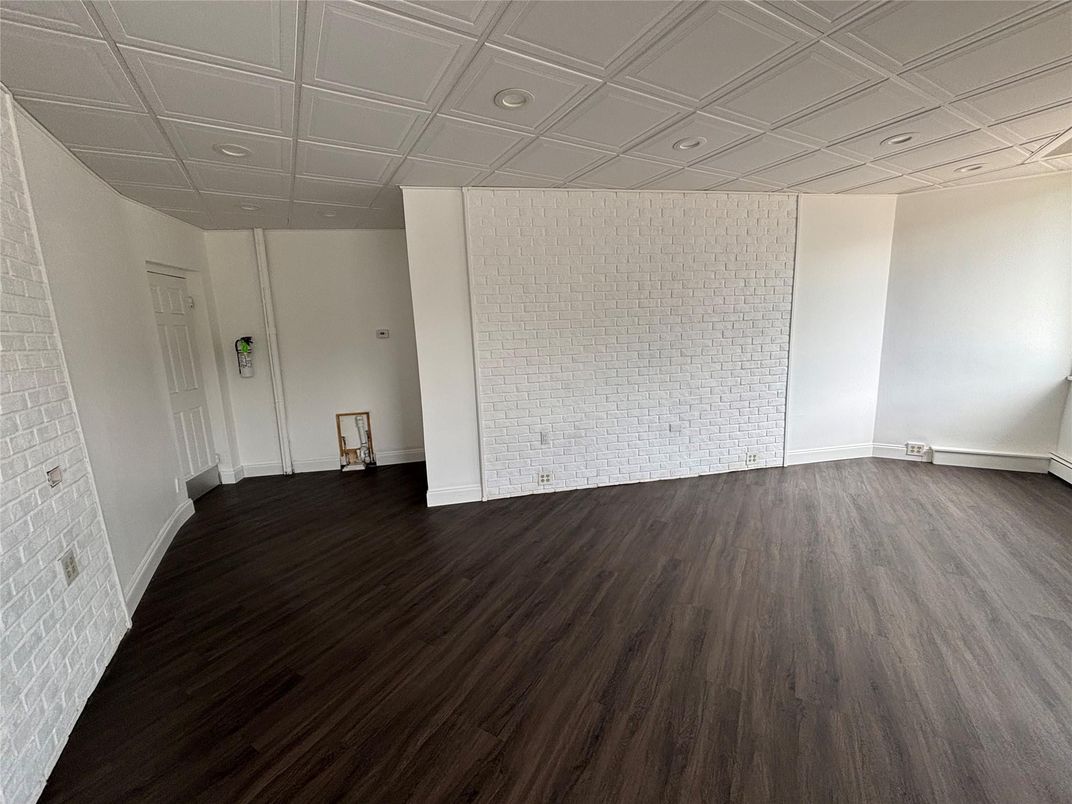 Empty room, Interior, Recessed Lighting, Stone Walls, Wood Texture Flooring