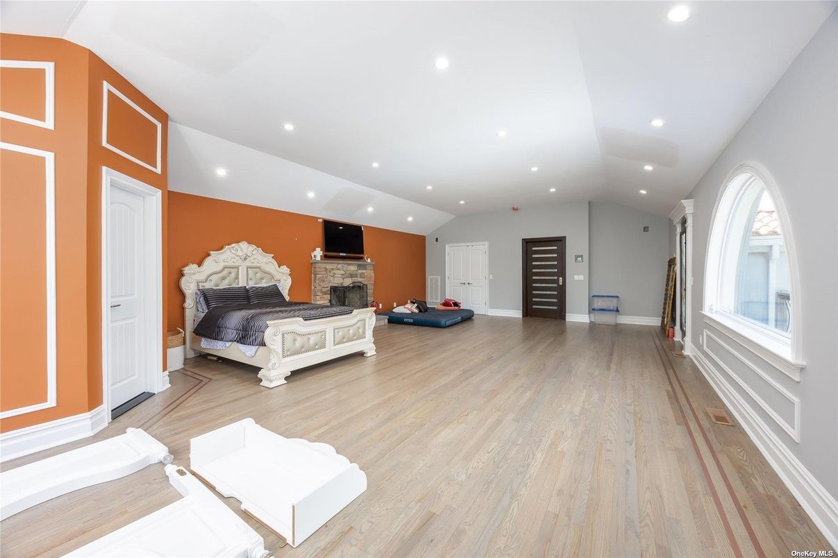 Bedroom, Fireplace, Interior, Recessed Lighting, Wood Texture Flooring