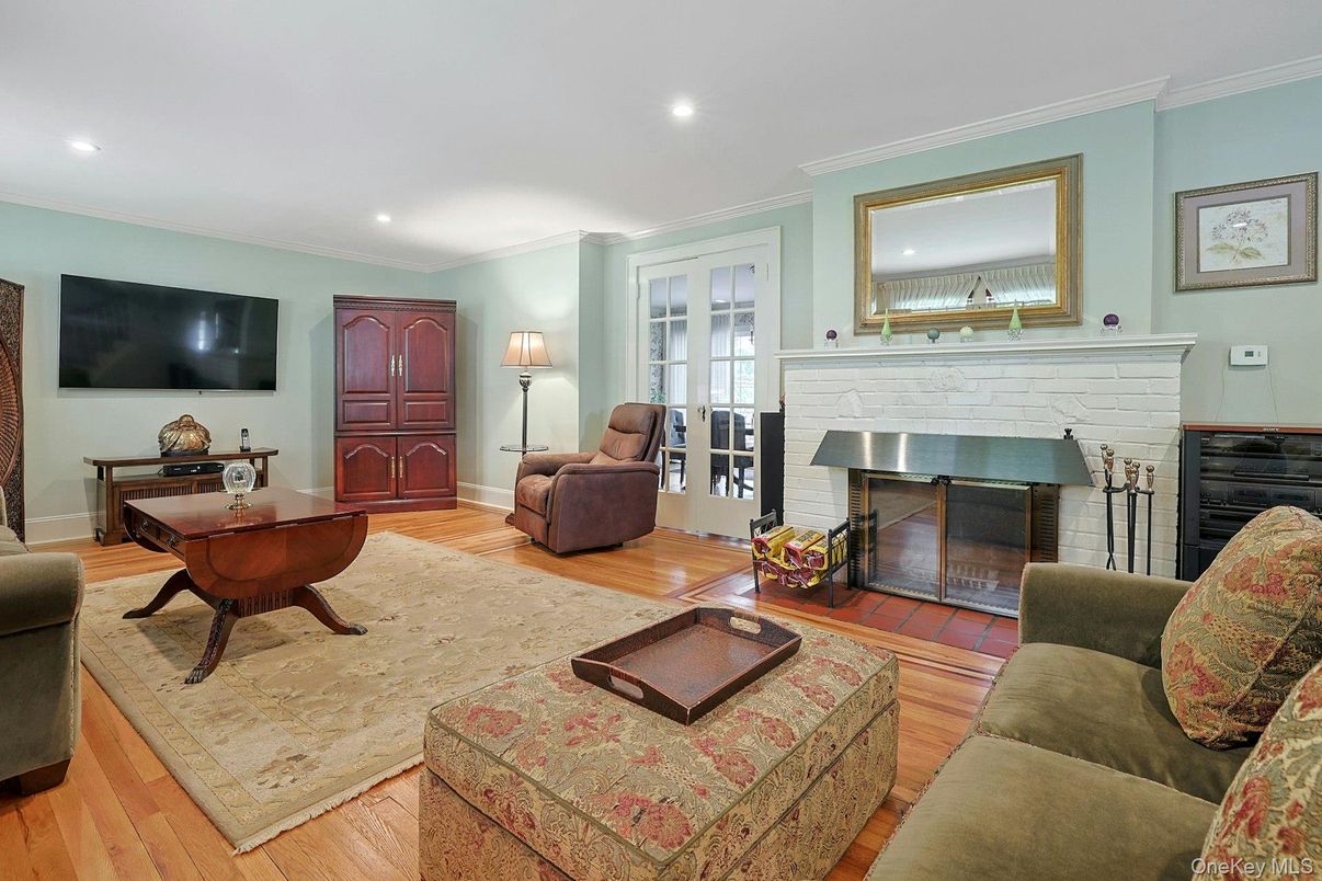 Fireplace, Interior, Living room, Piano, Recessed Lighting, Wood Texture Flooring