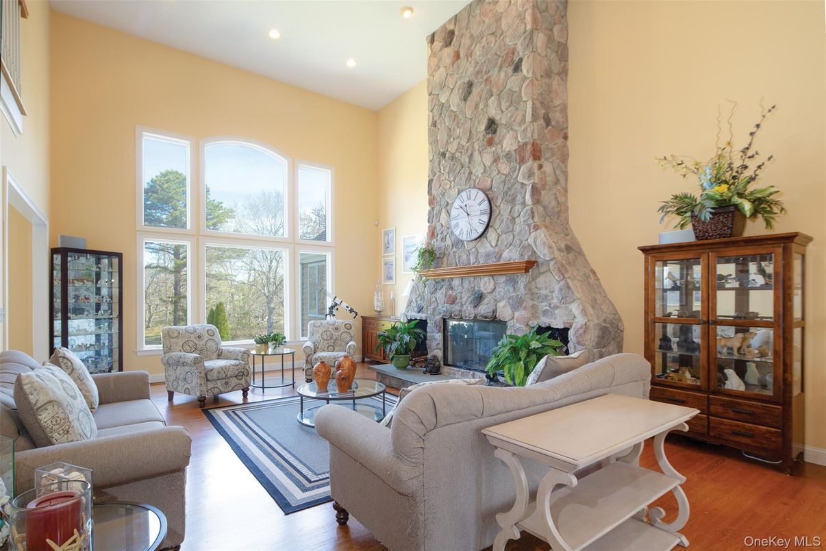 Fireplace, Interior, Living room, Recessed Lighting, Stone Walls, Wood Texture Flooring