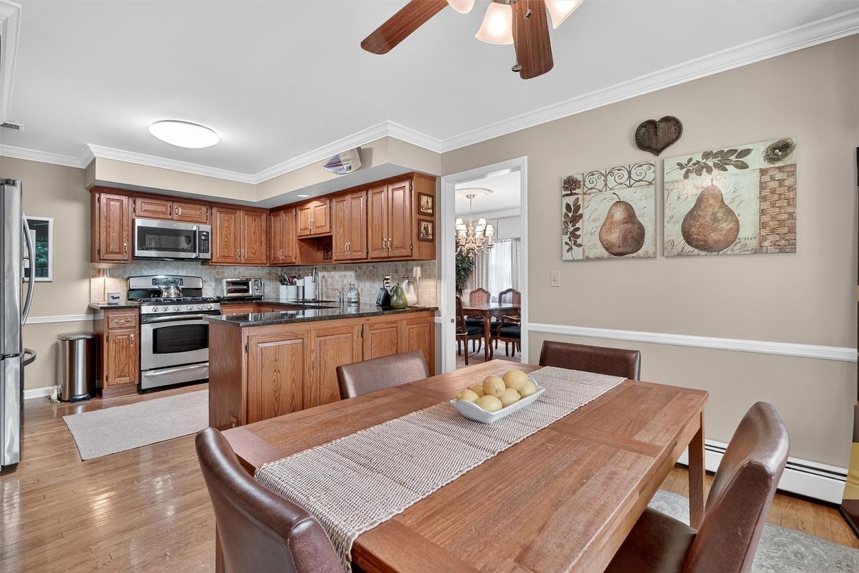 Chandelier, Dining room, Interior, Kitchen, Stainless Steel Appliances, Wood Texture Flooring