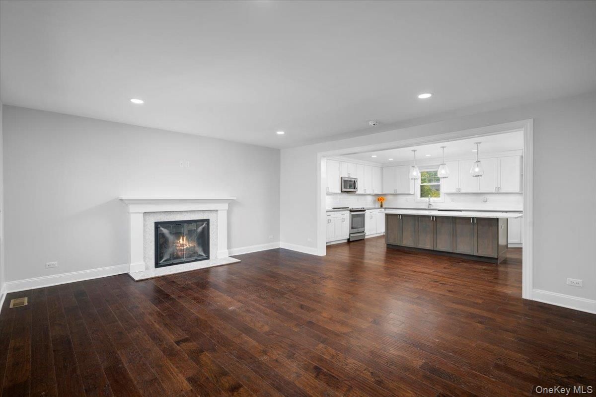 Empty room, Fireplace, Interior, Kitchen, Pendant Lights, Recessed Lighting, Wood Texture Flooring
