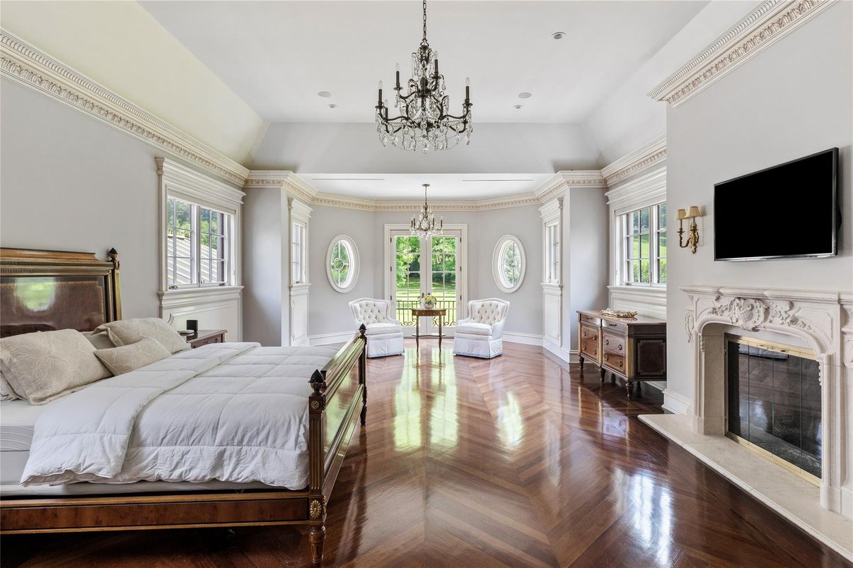 Bedroom, Chandelier, Fireplace, Interior, Recessed Lighting, Wood Texture Flooring