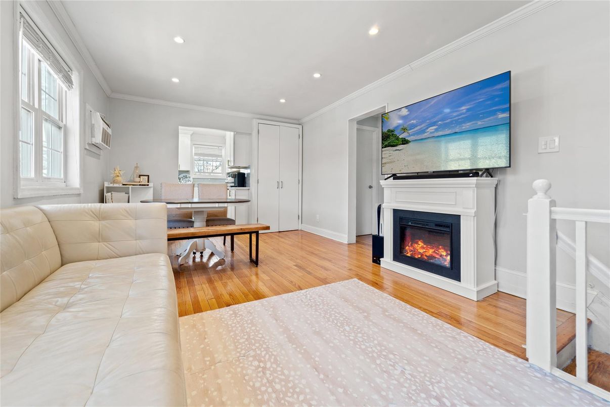 Fireplace, Interior, Living room, Piano, Recessed Lighting, Wood Texture Flooring