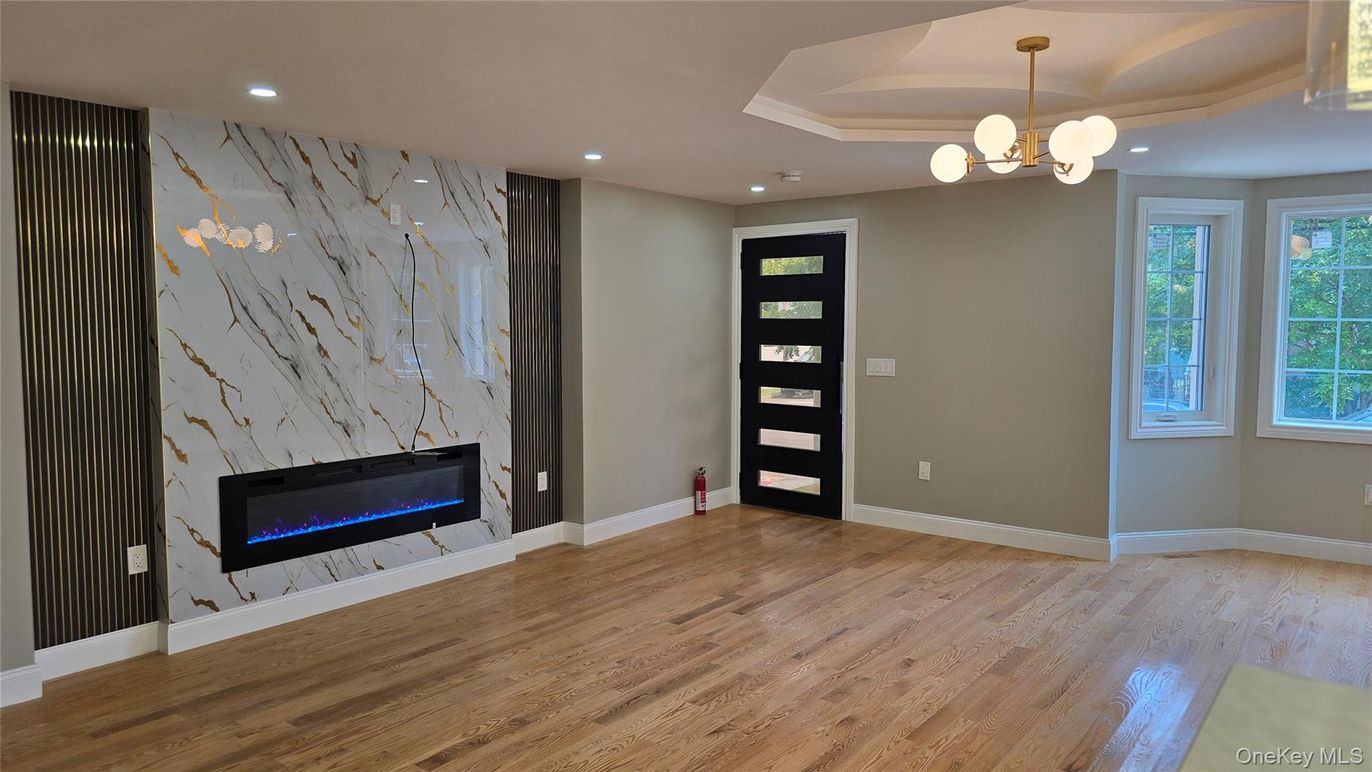 Empty room, Fireplace, Interior, Pendant Lights, Recessed Lighting, Wood Texture Flooring