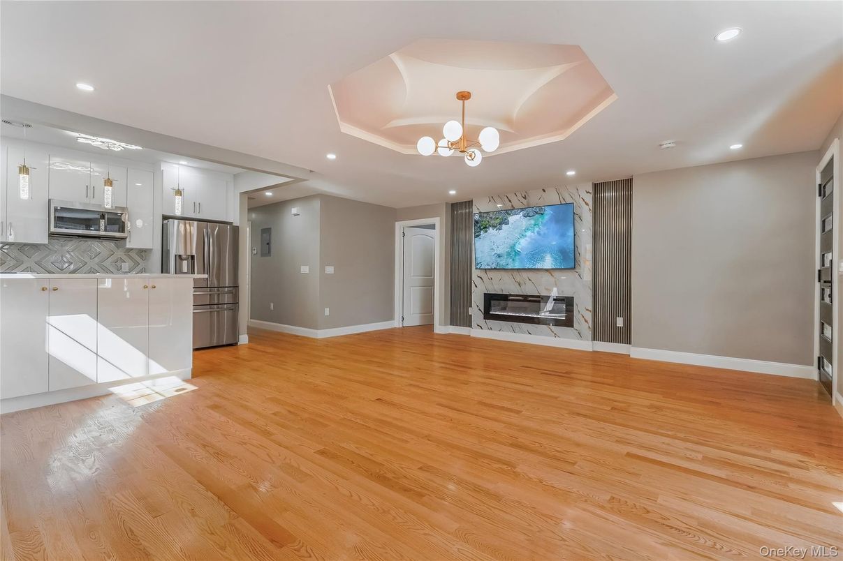 Chandelier, Empty room, Interior, Kitchen, Recessed Lighting, Stainless Steel Appliances, Wood Texture Flooring
