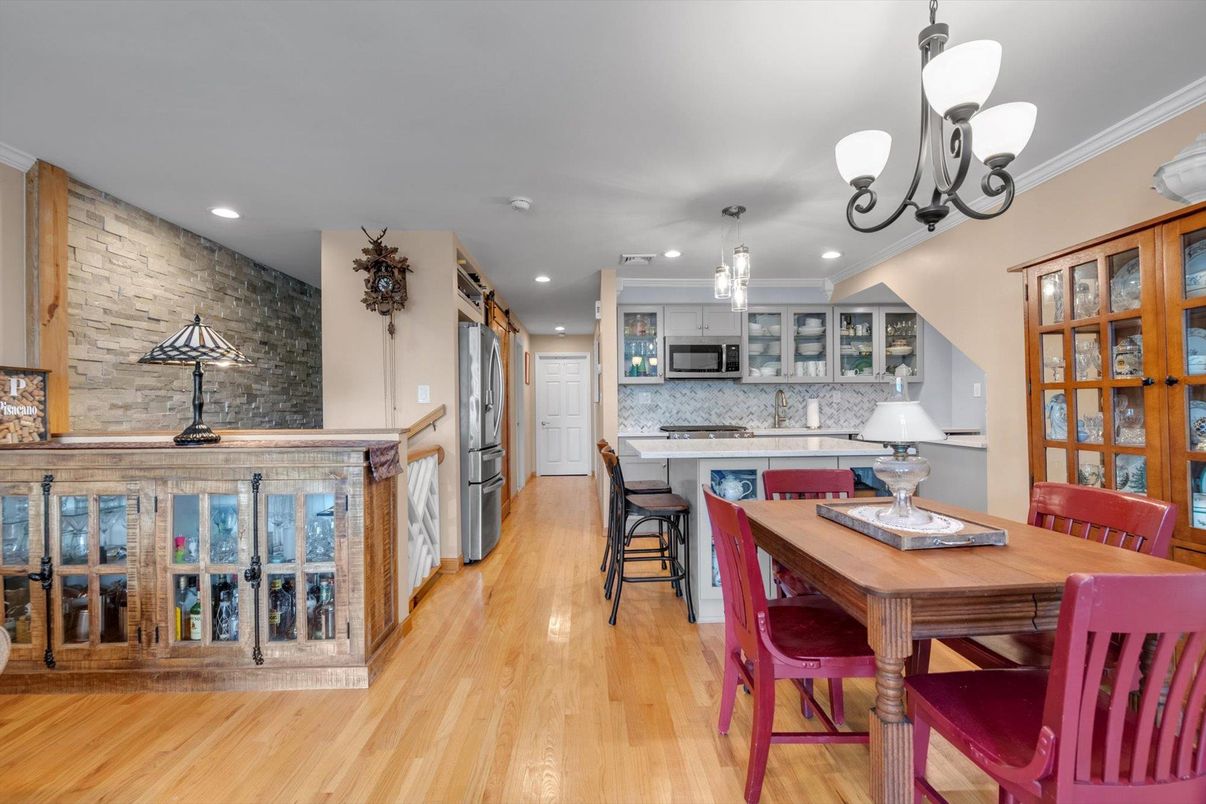 Dining room, Interior, Kitchen, Pendant Lights, Recessed Lighting, Stainless Steel Appliances, Stone Walls, Wood Texture Flooring