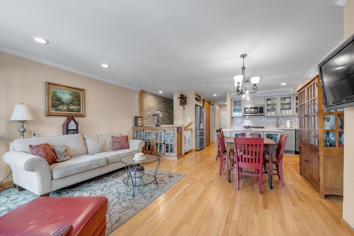 Dining room, Interior, Kitchen, Living room, Pendant Lights, Recessed Lighting, Stainless Steel Appliances, Wood Texture Flooring