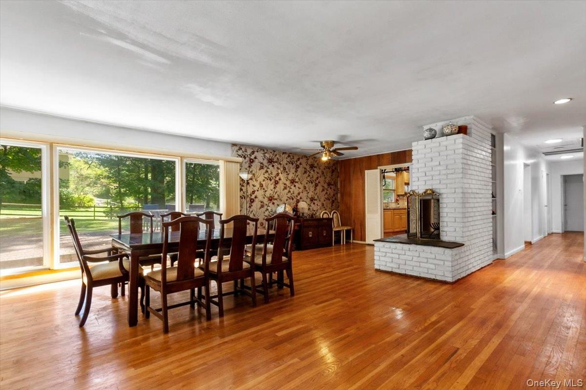 Dining room, Fireplace, Interior, Recessed Lighting, Stone Walls, Wood Texture Flooring