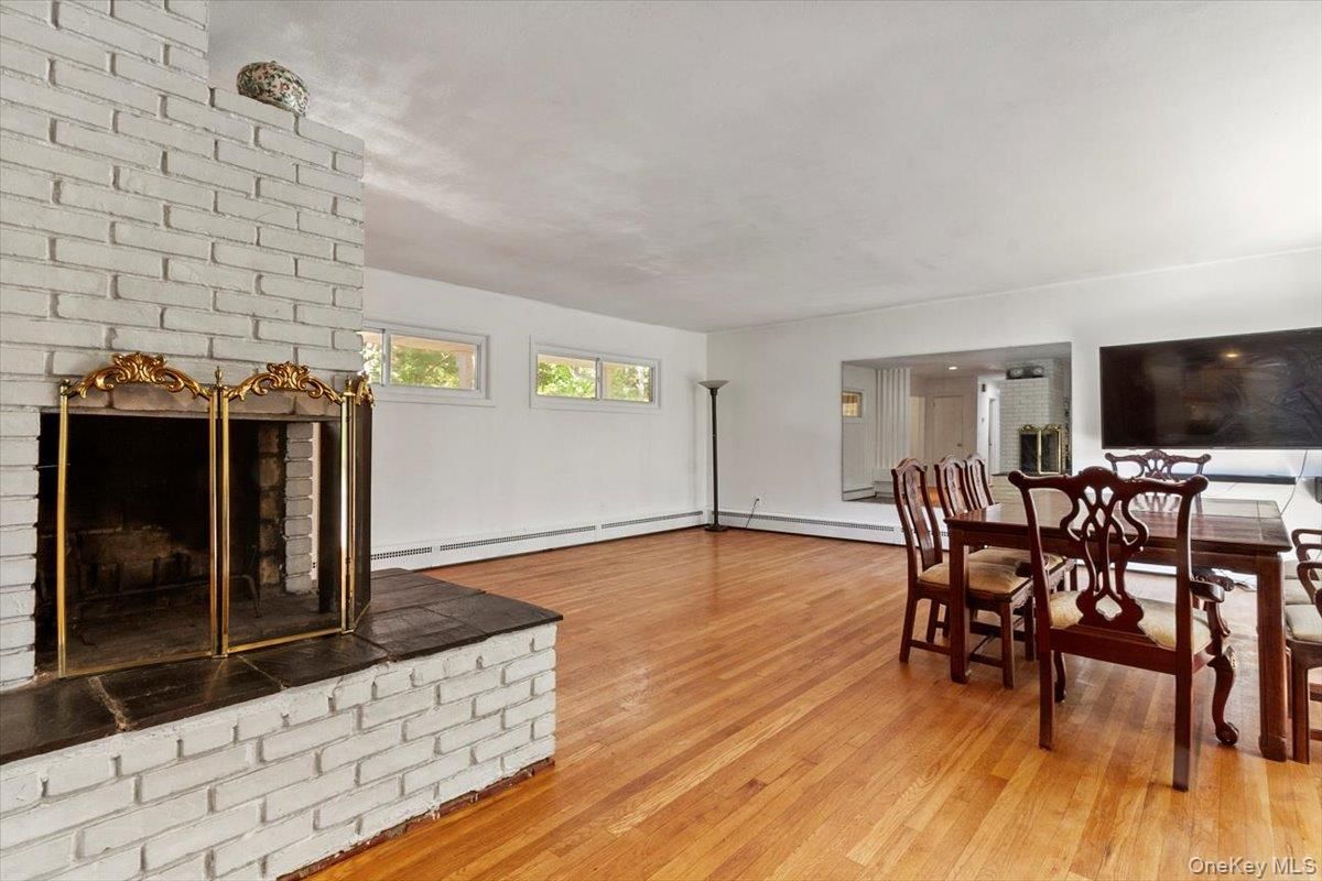 Dining room, Fireplace, Interior, Stone Walls, Wood Texture Flooring