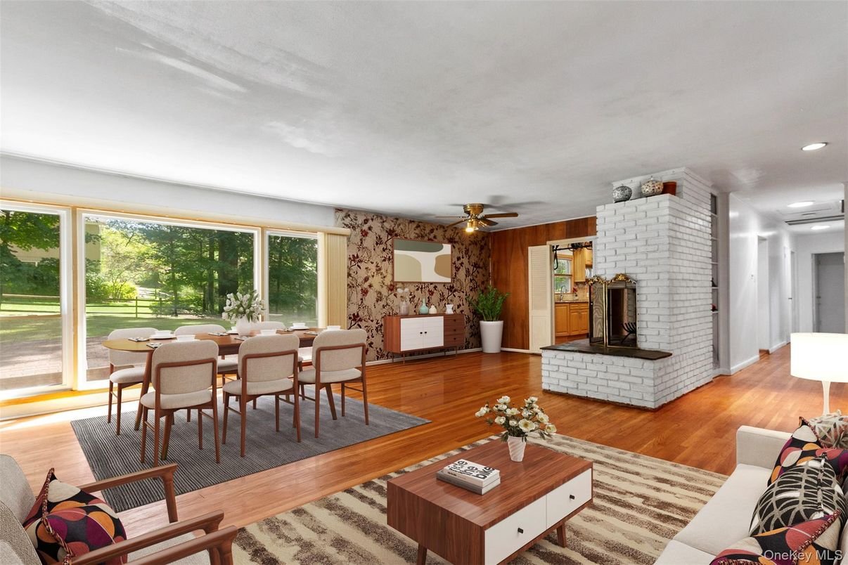Dining room, Fireplace, Interior, Living room, Recessed Lighting, Stone Walls, Wood Texture Flooring