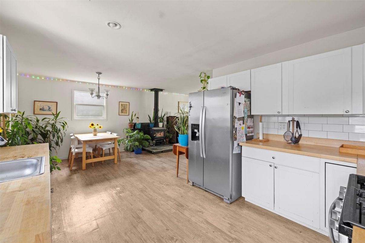 Dining room, Interior, Kitchen, Pendant Lights, Recessed Lighting, Stainless Steel Appliances, Wood Texture Flooring