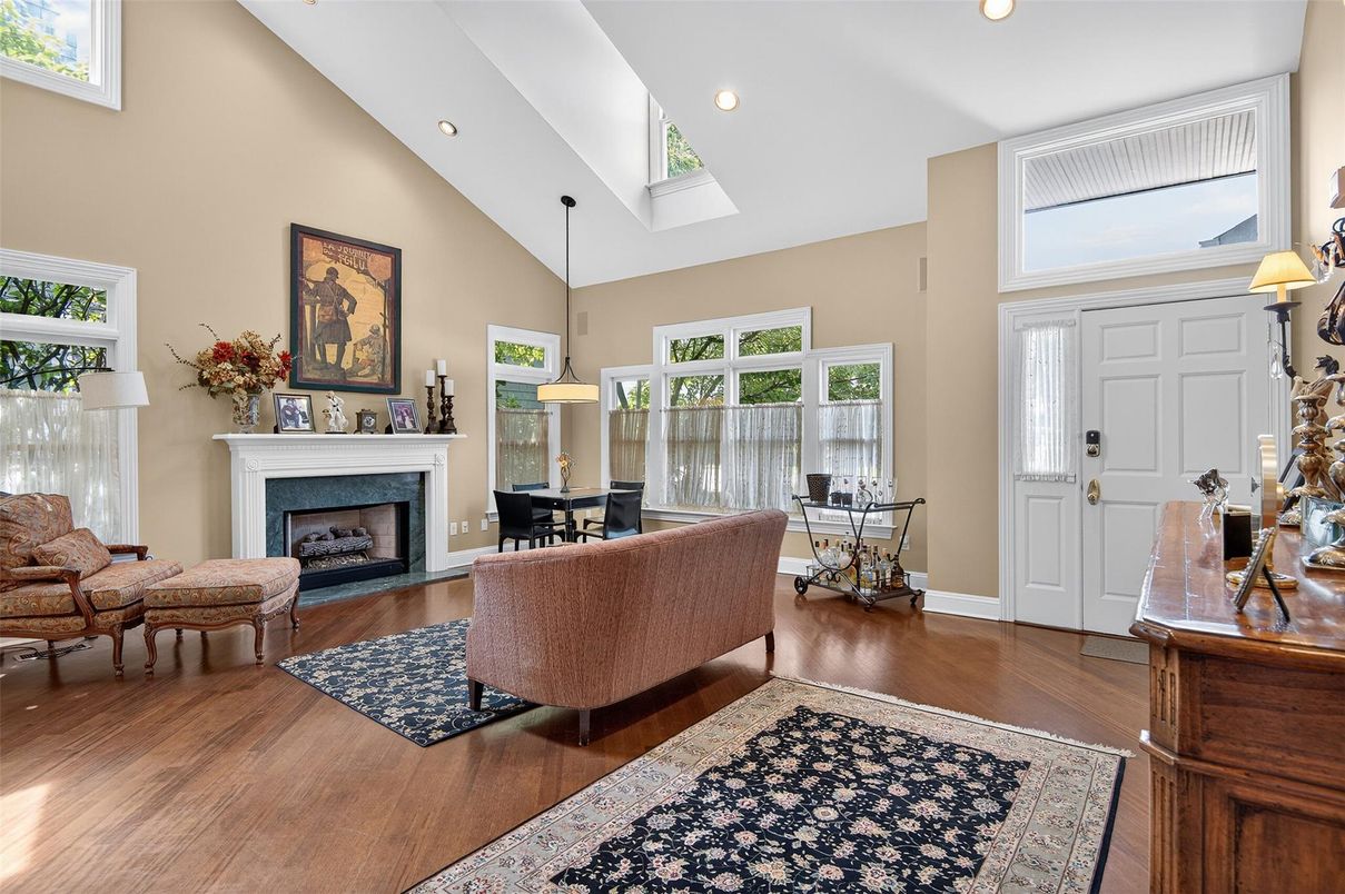 Dining room, Fireplace, Interior, Living room, Pendant Lights, Recessed Lighting, Wood Texture Flooring