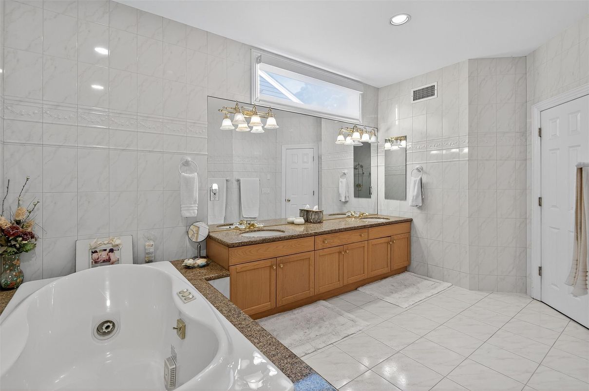 Bathroom, Dual Sink Vanities, Glass Shower, Interior, Marble Walls, Recessed Lighting