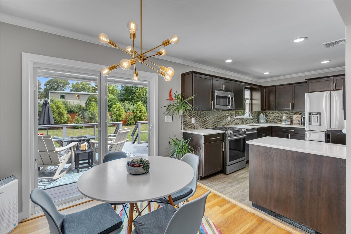 Dining room, Interior, Kitchen, Pendant Lights, Recessed Lighting, Stainless Steel Appliances, Wood Texture Flooring