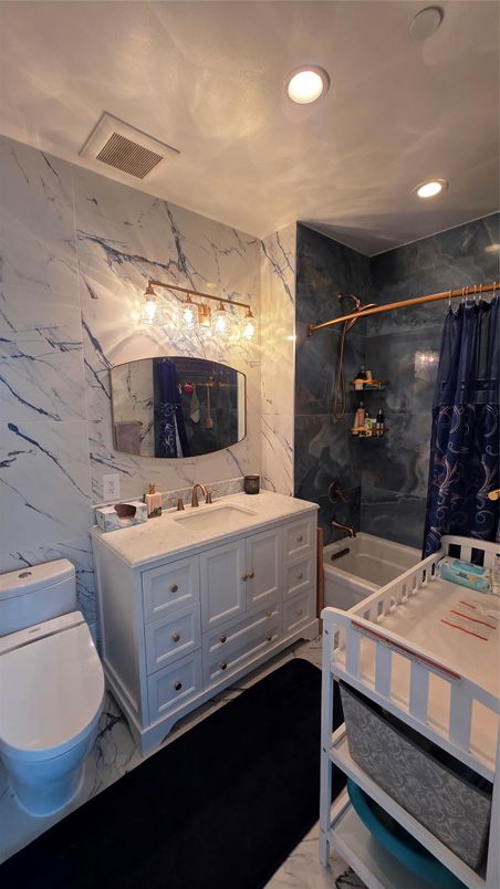 Bathroom, Dual Sink Vanities, Interior, Marble, Marble Walls, Recessed Lighting