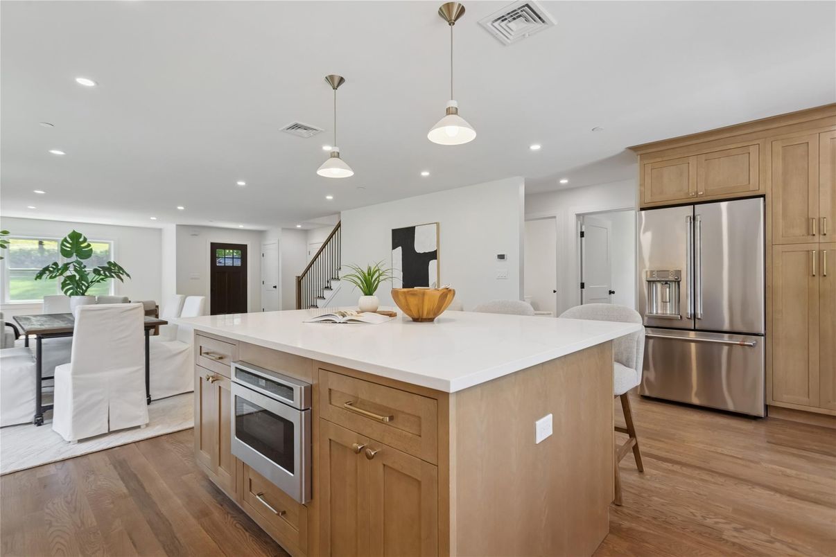Dining room, Interior, Kitchen, Pendant Lights, Recessed Lighting, Stainless Steel Appliances, Wood Texture Flooring