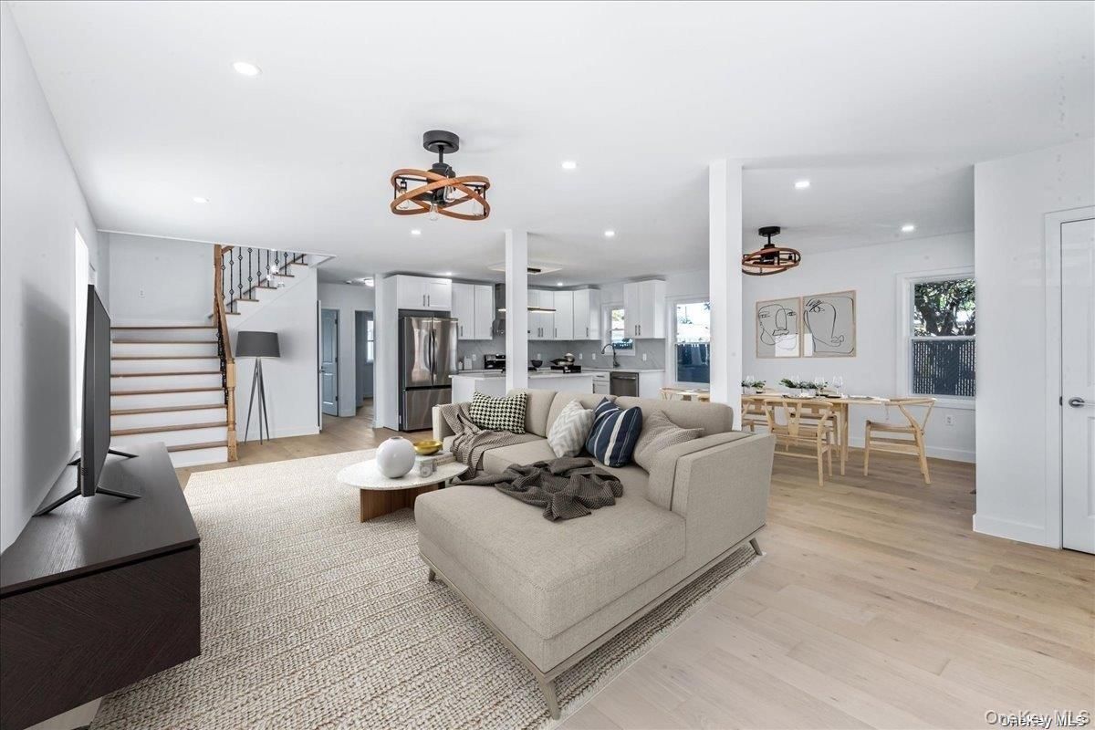 Dining room, Interior, Kitchen, Living room, Recessed Lighting, Stainless Steel Appliances, Wood Texture Flooring