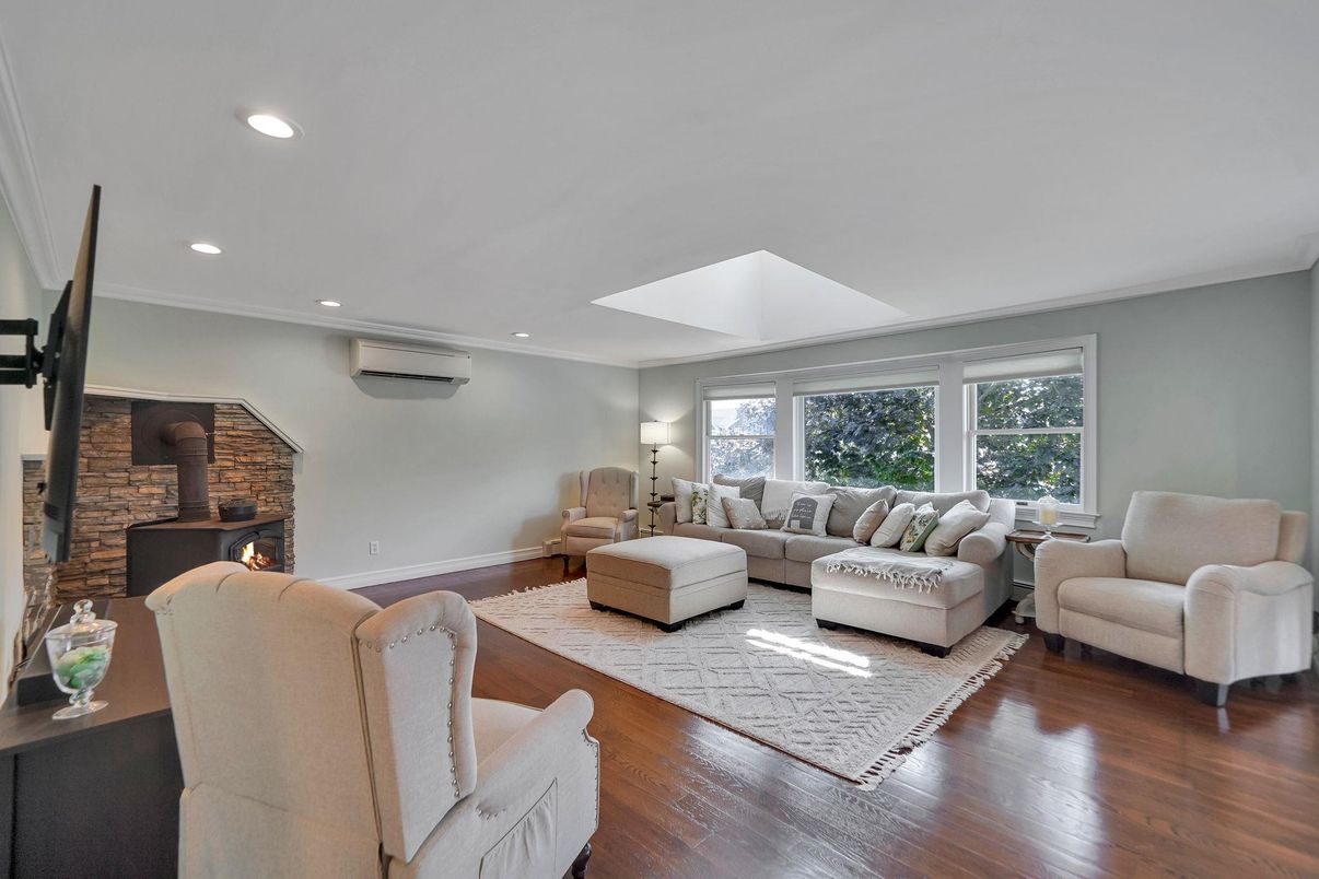 Fireplace, Interior, Living room, Recessed Lighting, Stone Walls, Wood Texture Flooring