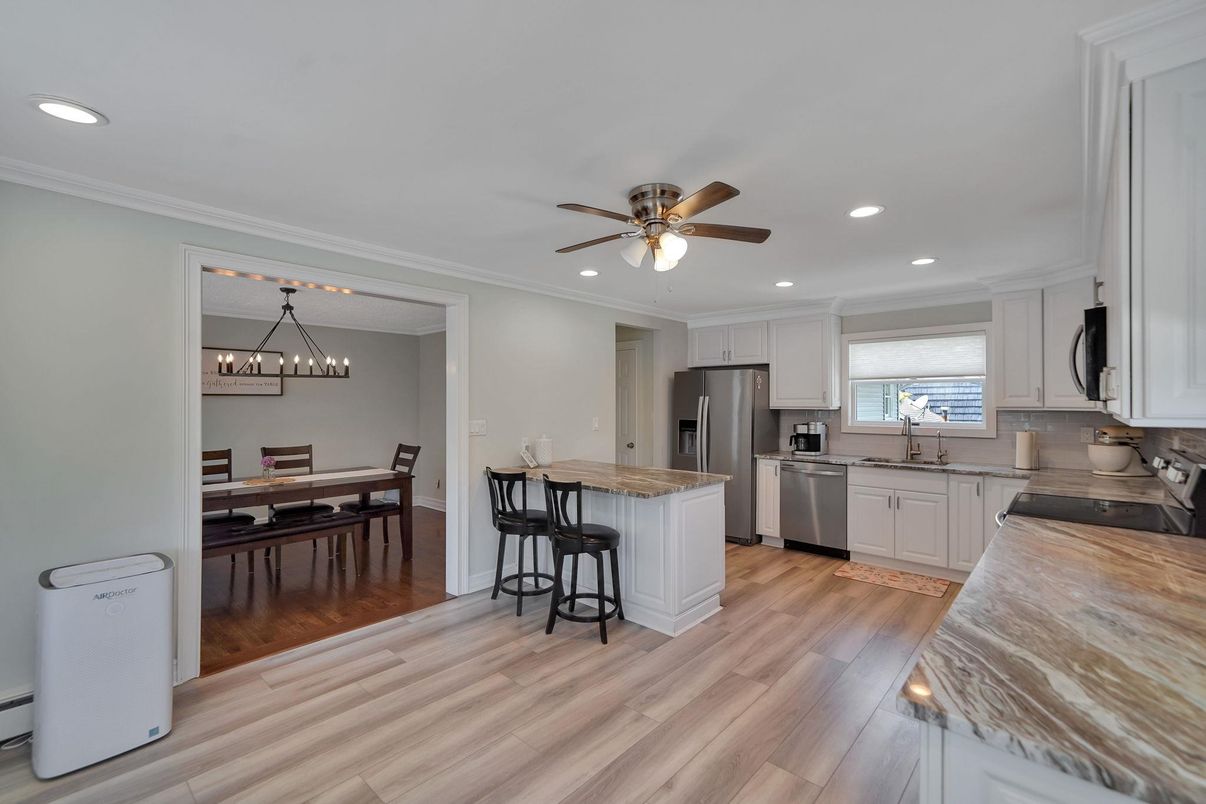 Dining room, Interior, Kitchen, Recessed Lighting, Stainless Steel Appliances, Wood Texture Flooring