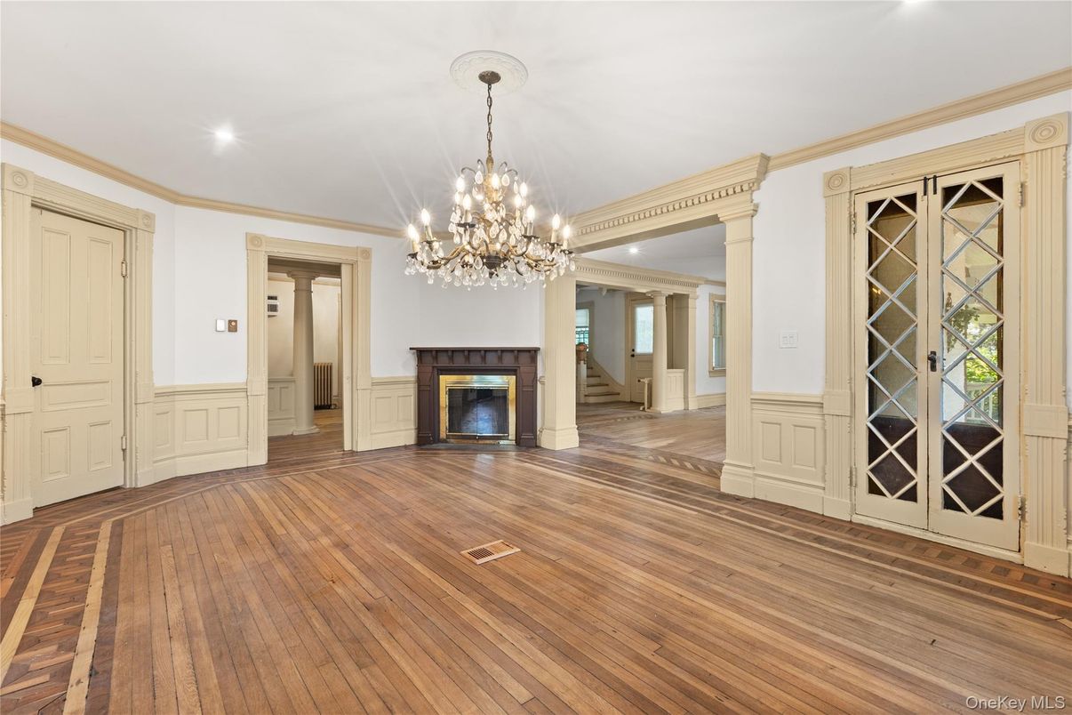 Chandelier, Empty room, Fireplace, Interior, Recessed Lighting, Wood Texture Flooring