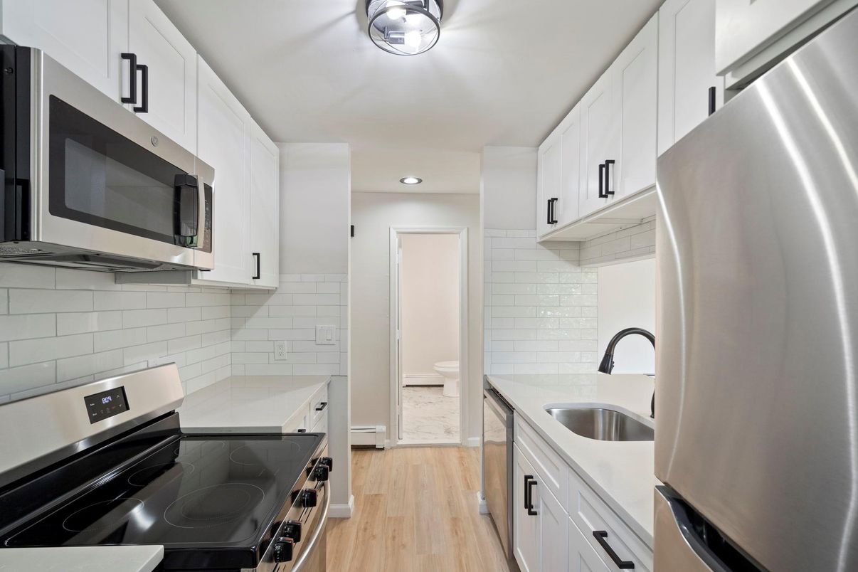 Interior, Kitchen, Recessed Lighting, Stainless Steel Appliances, Wood Texture Flooring