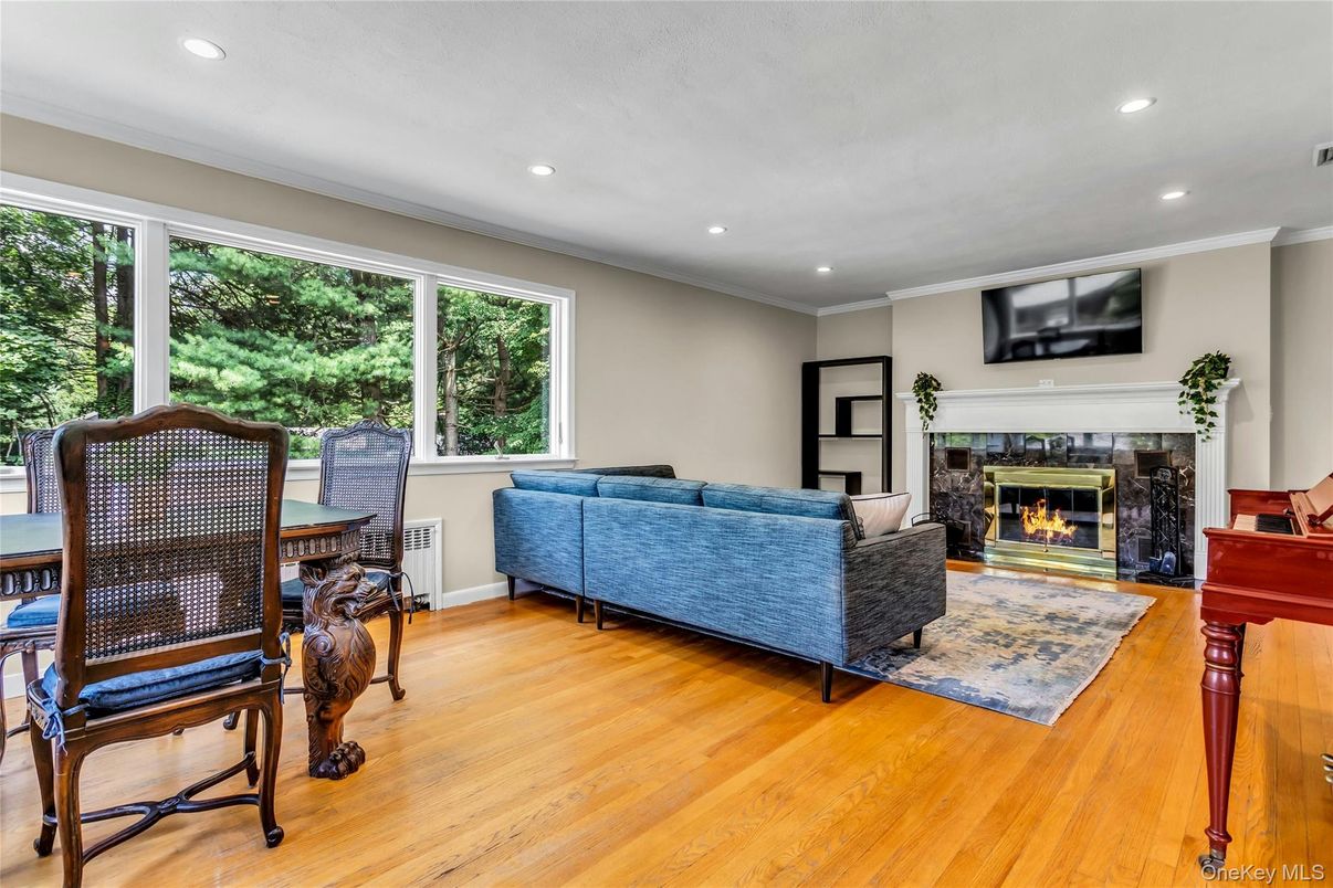 Dining room, Fireplace, Interior, Living room, Recessed Lighting, Wood Texture Flooring