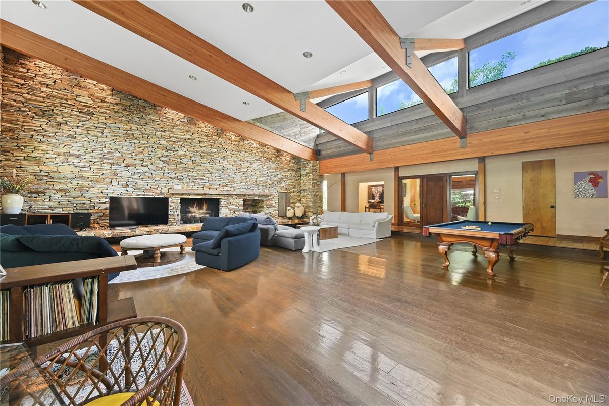 Billiard Table, Fireplace, Game Room, Interior, Living room, Recessed Lighting, Stone Walls, Wooden Beams, Wood Texture Flooring