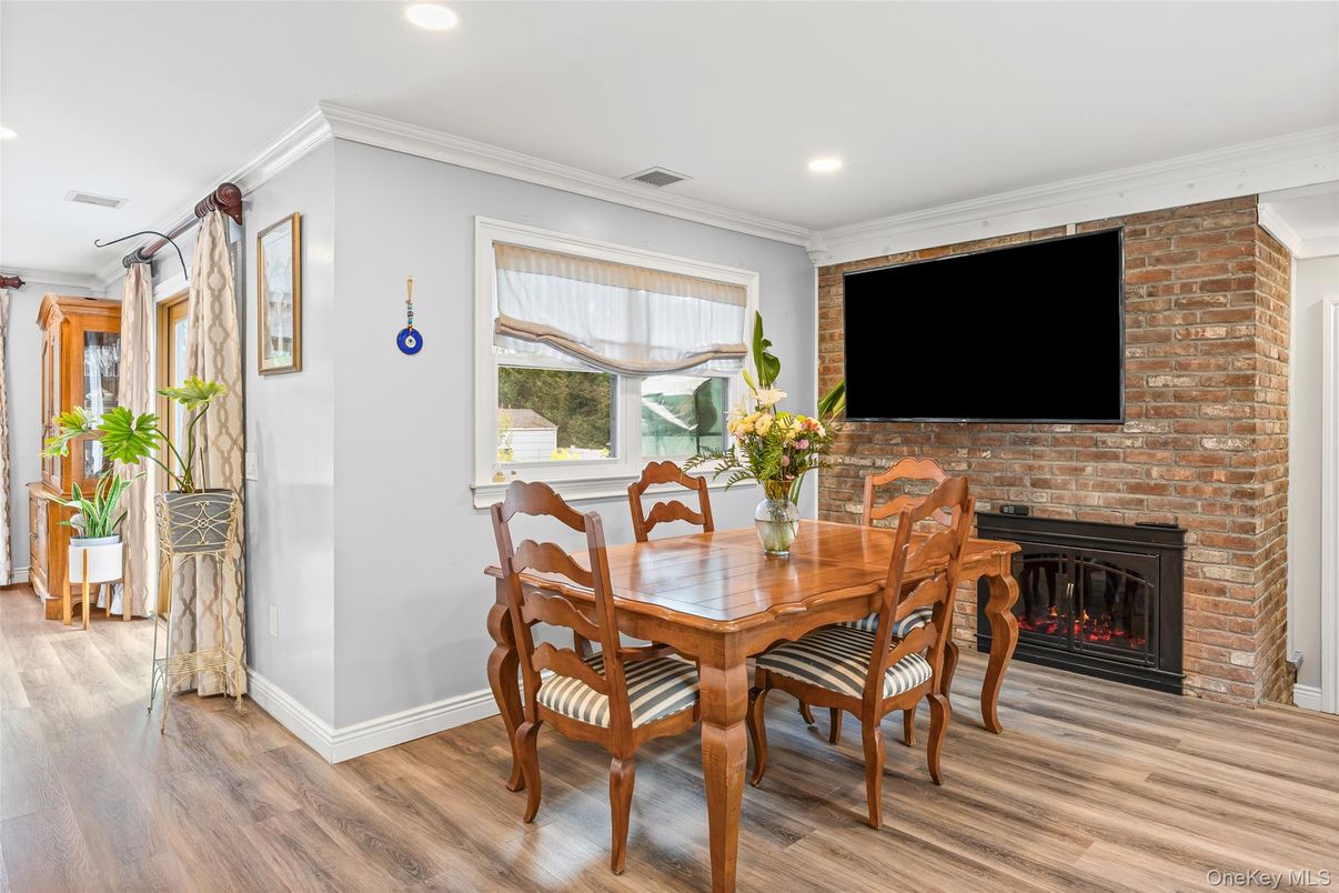 Dining room, Fireplace, Interior, Recessed Lighting, Stone Walls, Wood Texture Flooring