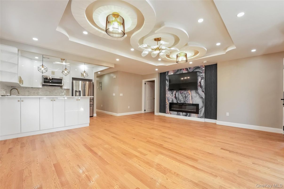 Fireplace, Interior, Kitchen, Pendant Lights, Recessed Lighting, Stainless Steel Appliances, Wood Texture Flooring