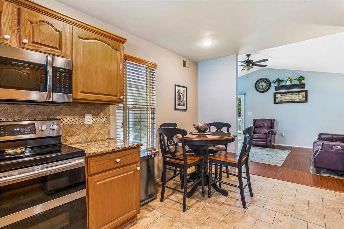 Dining room, Interior, Kitchen, Recessed Lighting, Stainless Steel Appliances, Wood Texture Flooring