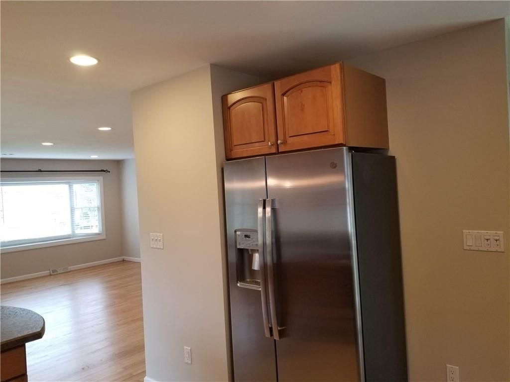 Elevator, Interior, Kitchen, Recessed Lighting, Stainless Steel Appliances, Wood Texture Flooring