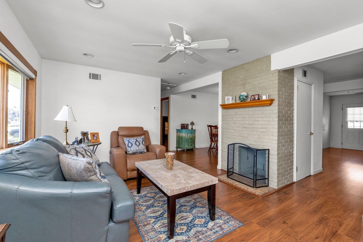 Fireplace, Interior, Living room, Recessed Lighting, Stone Walls, Wood Texture Flooring