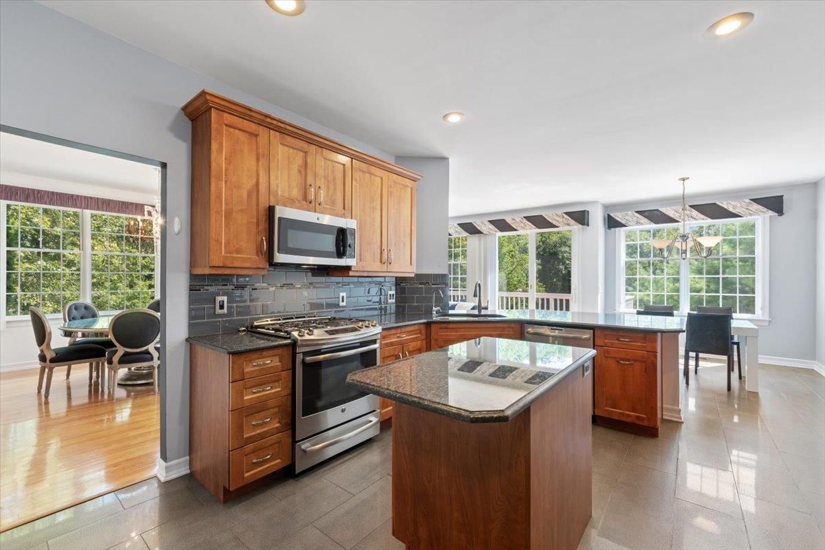 Dining room, Interior, Kitchen, Recessed Lighting, Stainless Steel Appliances, Wood Texture Flooring