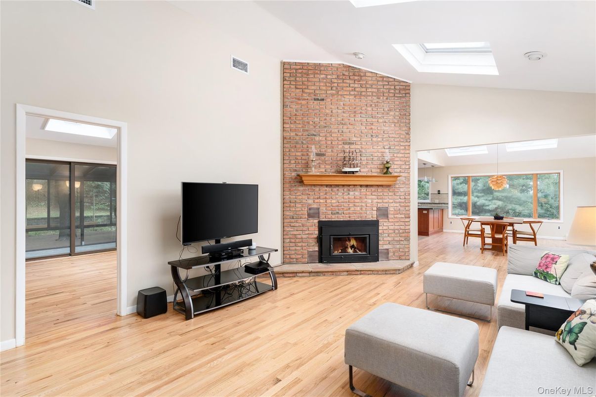Dining room, Fireplace, Interior, Living room, Pendant Lights, Stone Walls, Wood Texture Flooring
