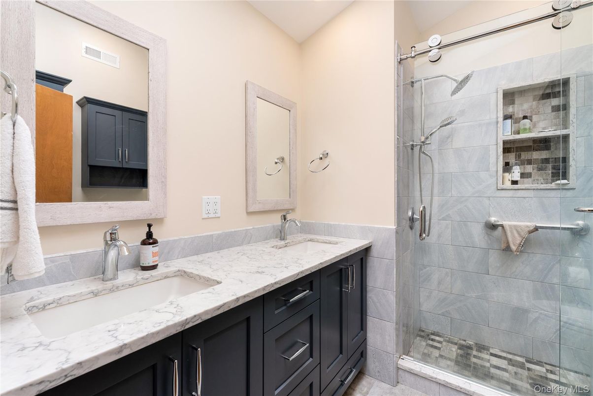 Bathroom, Dual Sink Vanities, Glass Shower, Interior, Marble Walls