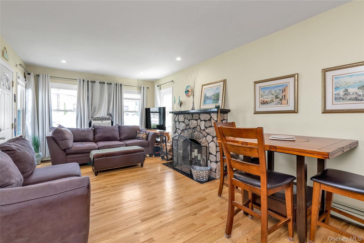 Dining room, Fireplace, Interior, Living room, Recessed Lighting, Wood Texture Flooring