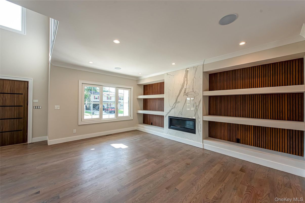 Empty room, Fireplace, Interior, Marble Walls, Recessed Lighting, Wood Texture Flooring