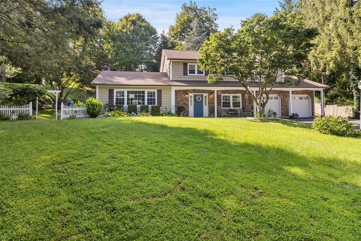 Attached, Backyard, Exterior, Facade, Brick Facade, Cape Cod