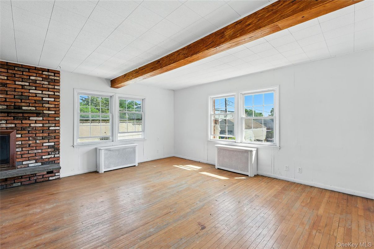 Empty room, Fireplace, Interior, Stone Walls, Wooden Beams, Wood Texture Flooring