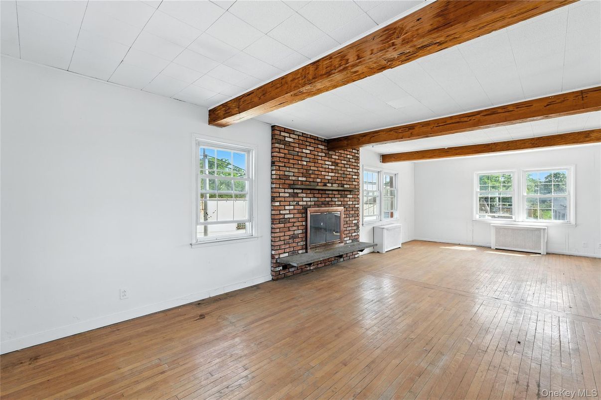 Empty room, Fireplace, Interior, Stone Walls, Wooden Beams, Wood Texture Flooring