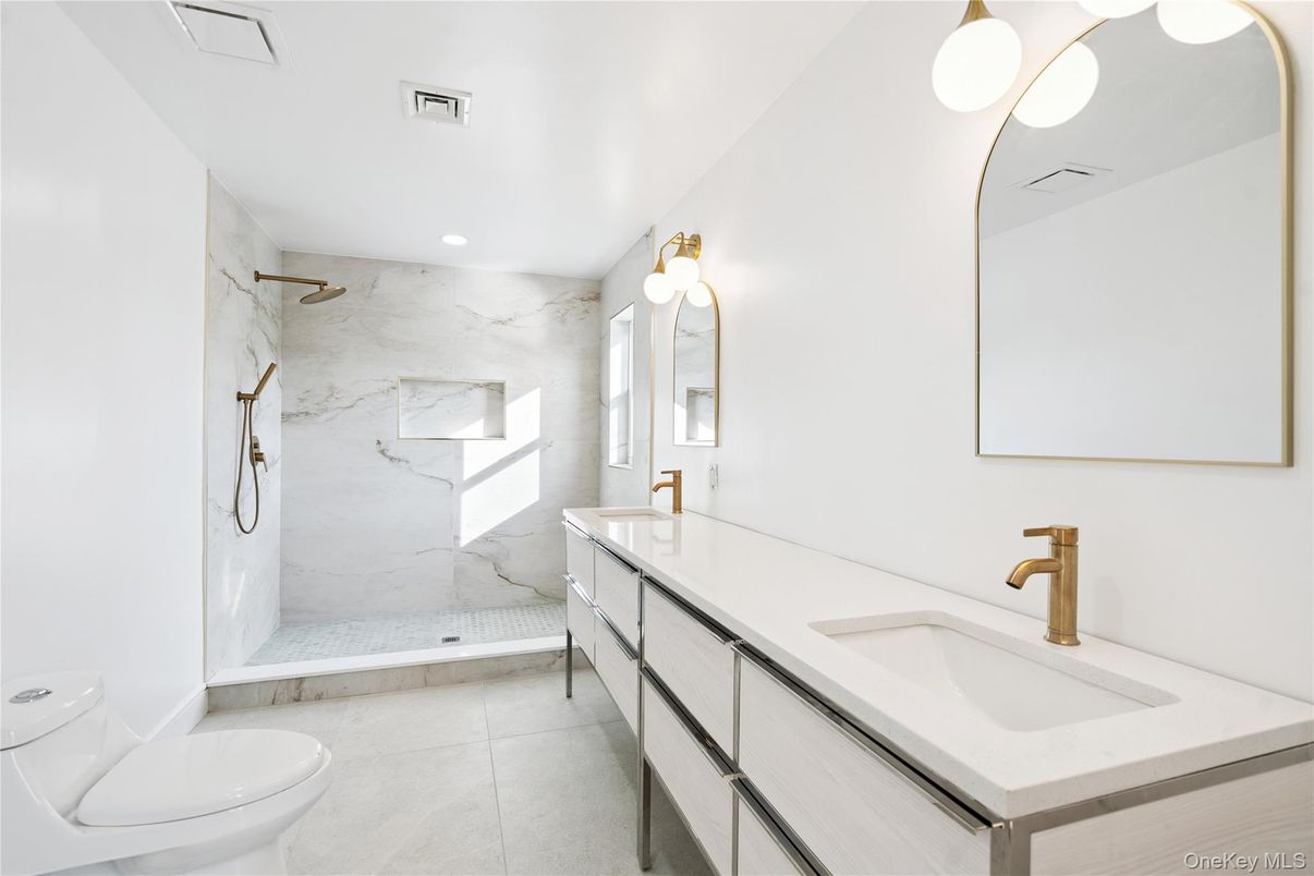 Bathroom, Dual Sink Vanities, Glass Shower, Interior, Marble Walls, Recessed Lighting
