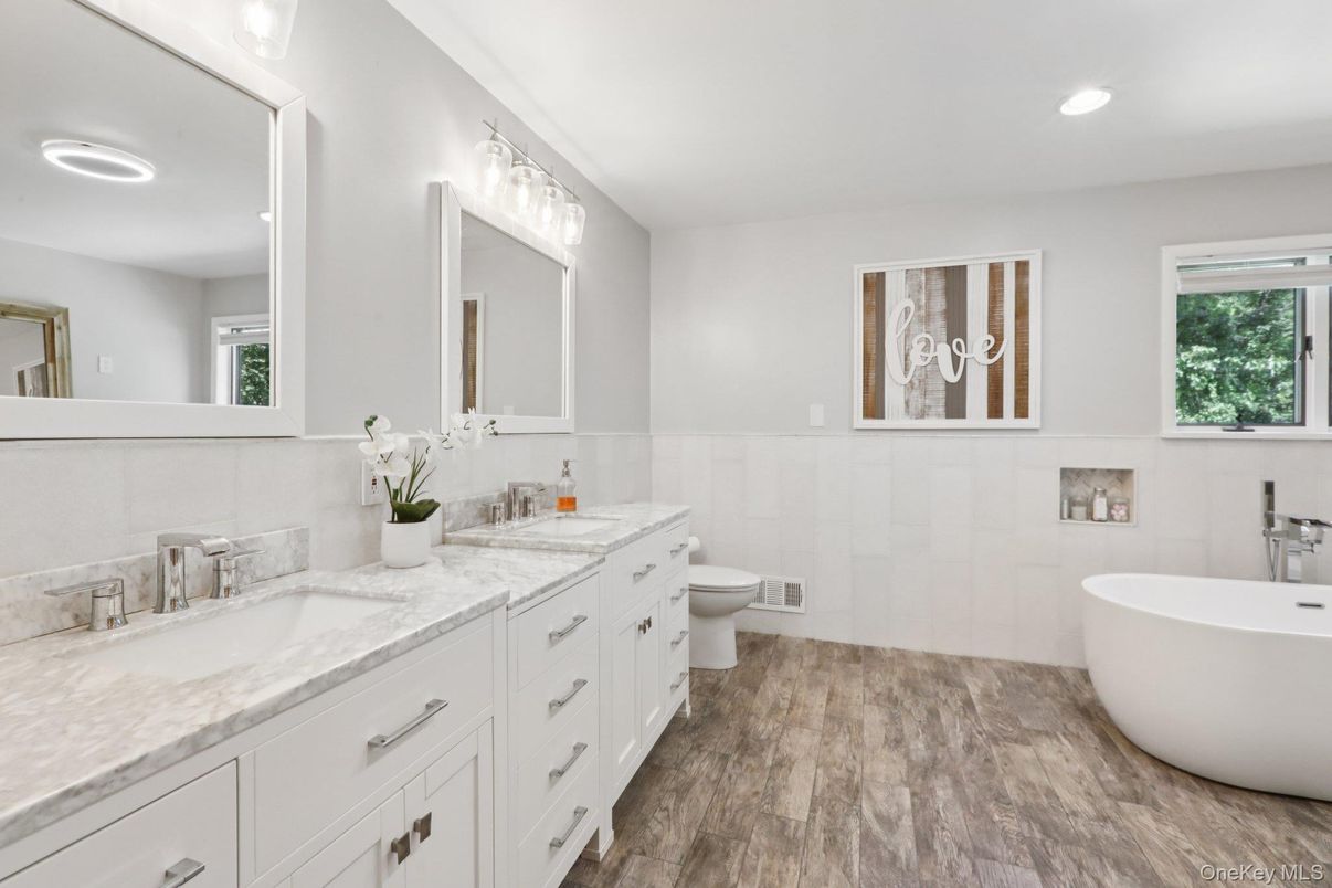 Bathroom, Dual Sink Vanities, Free Standing Baths, Interior, Recessed Lighting, Wood Texture Flooring