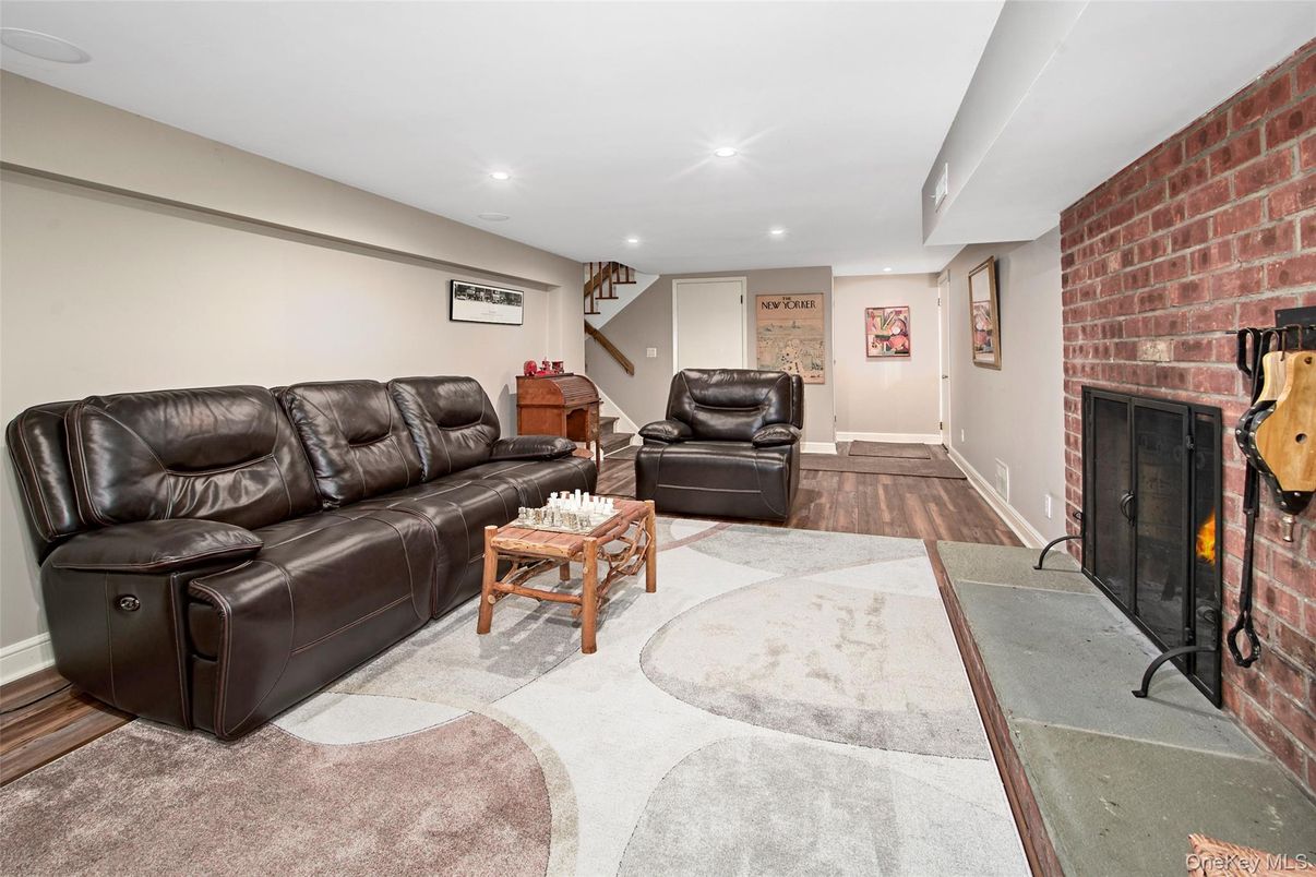 Fireplace, Interior, Living room, Recessed Lighting, Stone Walls, Wood Texture Flooring